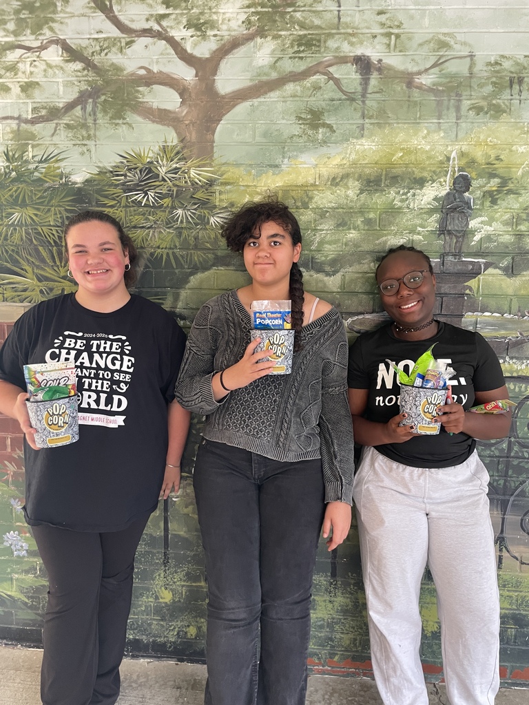 Three top readers and their prizes from the library.