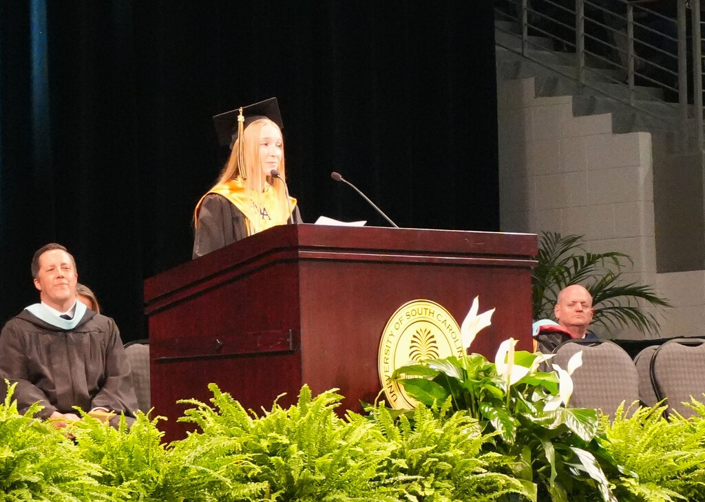 NAHS Valedictorian speaking at the podium. 
