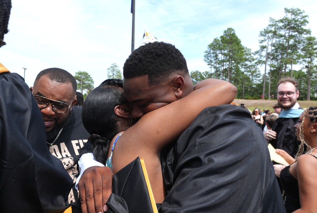 NAHS student hugging an adult. 