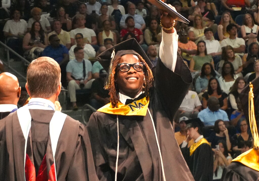 NAHS male student poses with his diploma. 