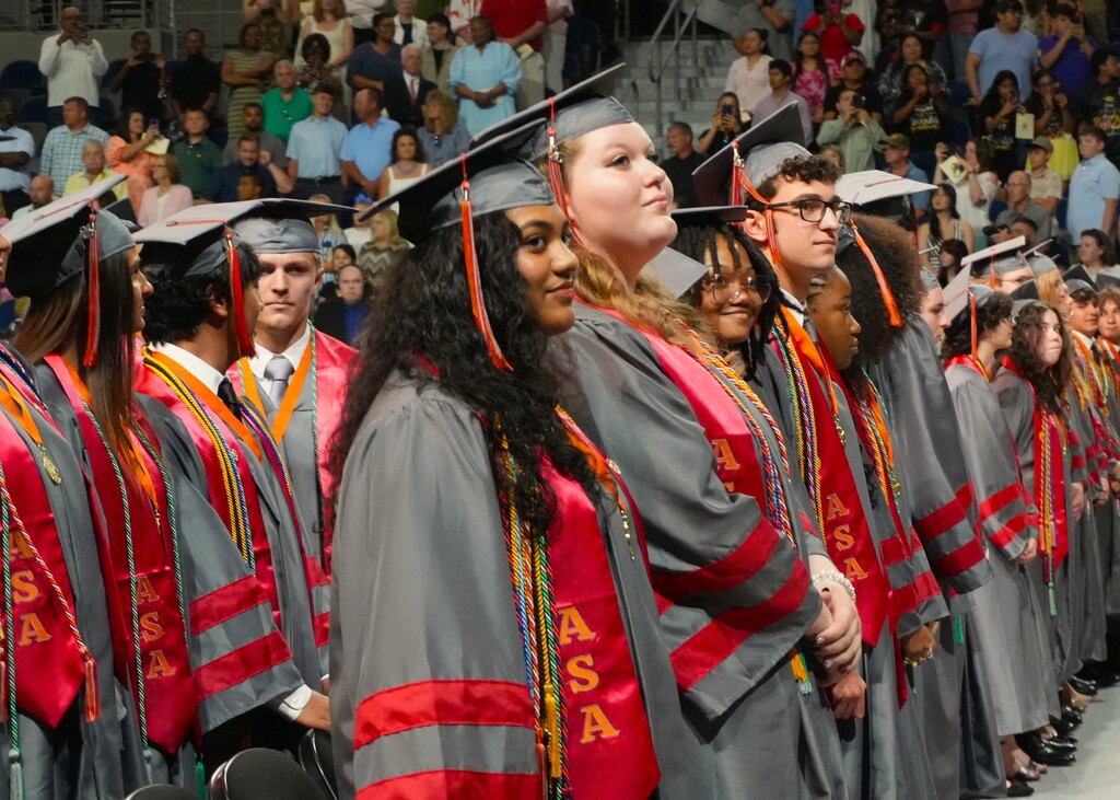 ASA students standing in a line at graduation. 