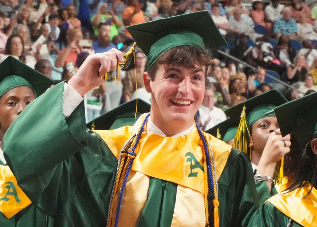 An Aiken High graduate grabs his tassle on his graduation cap. 