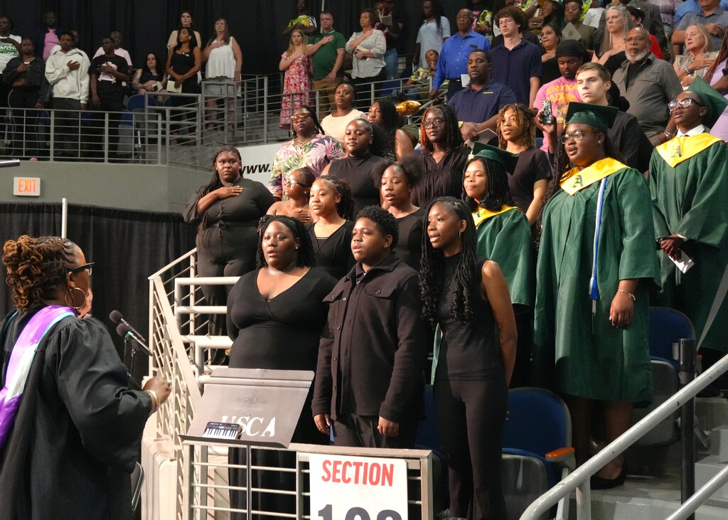 Select members of Aiken High's chorus sing during graduation.