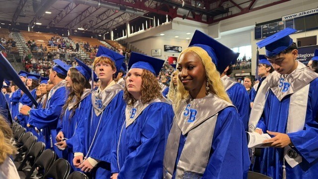 Silver Bluff High School graduates standing during their ceremony.