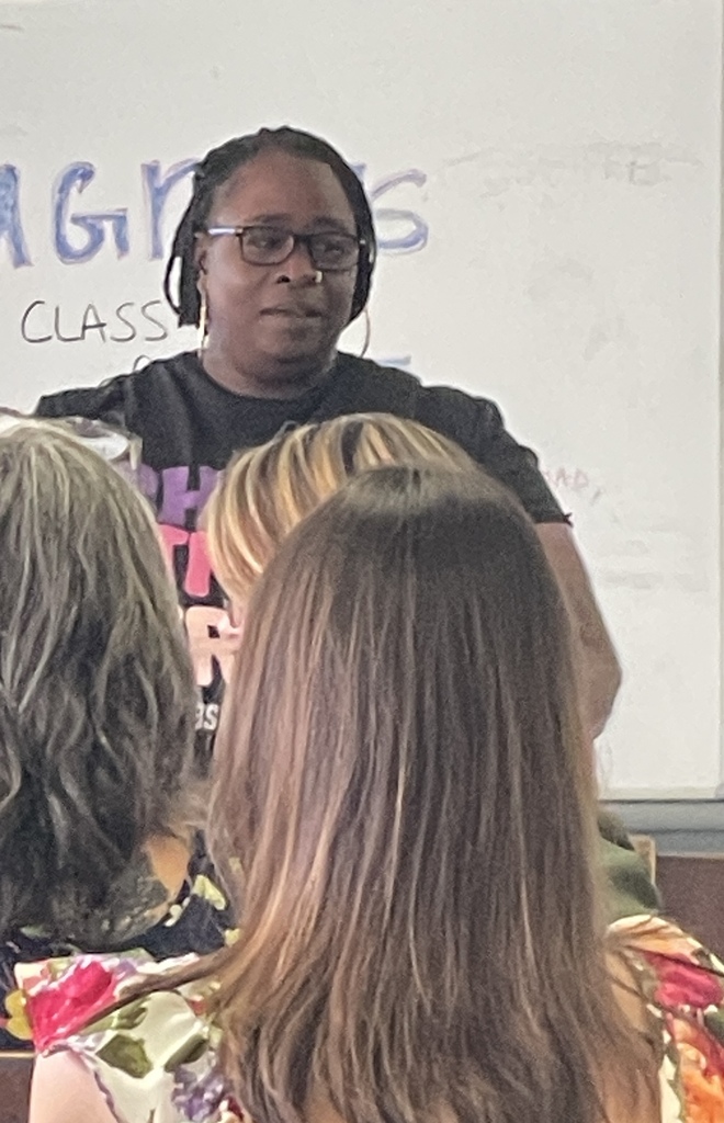 Ms. Mixon saying goodbye to the staff.