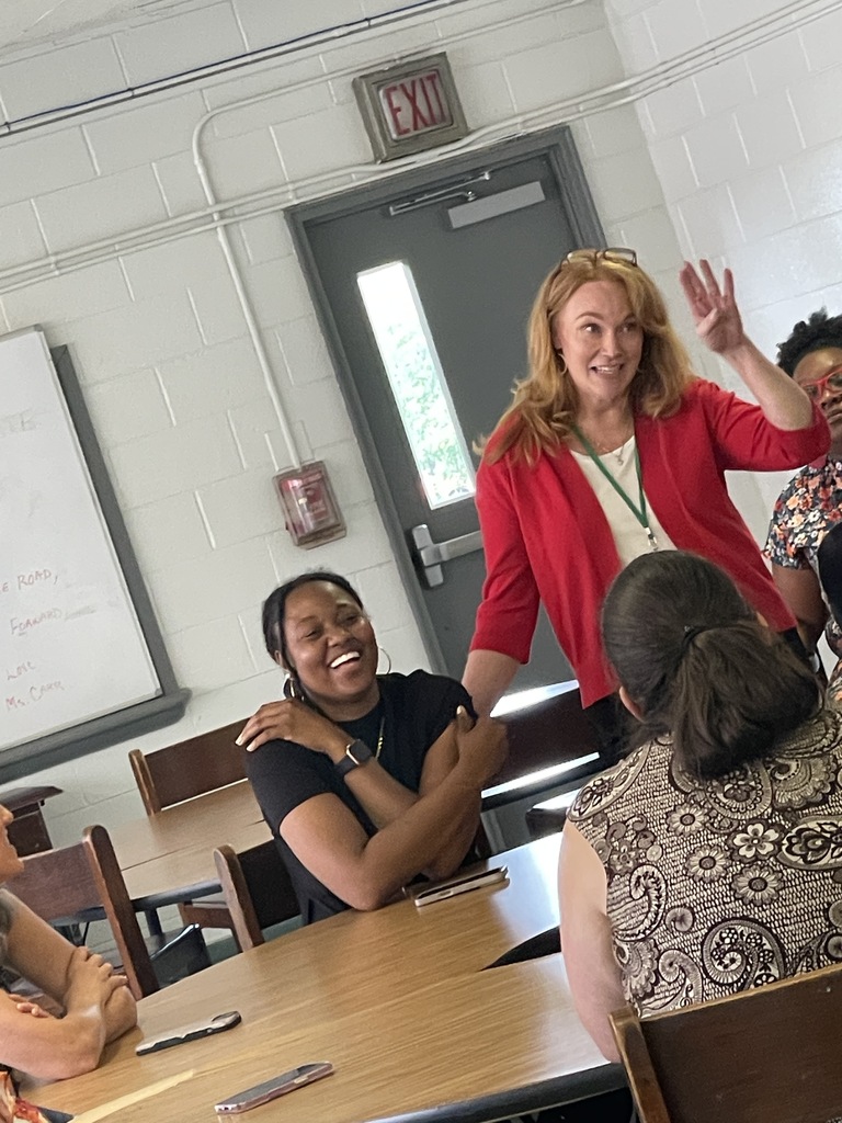 Ms. Altringer speaking to staff during a luncheon.