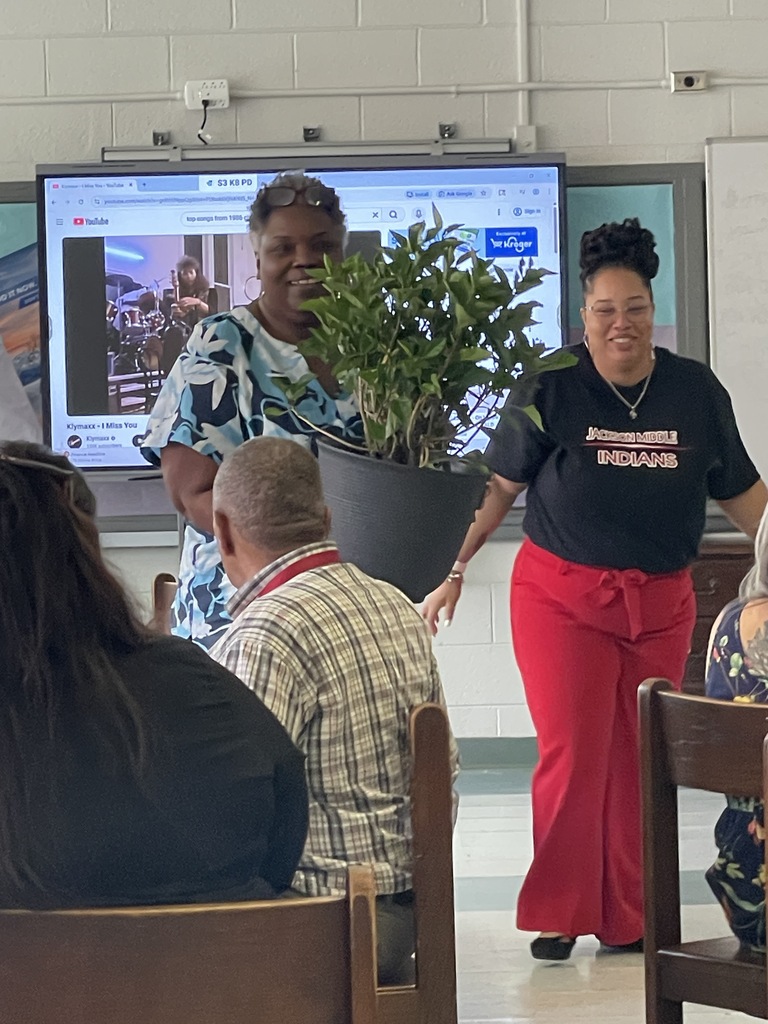 Ms. Dooley with her retirement gift presented by Mrs. McKie.