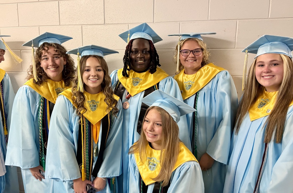 Group of Ridge-Spring Monetta High School Students posing for a group photo wearing their caps and gowns.