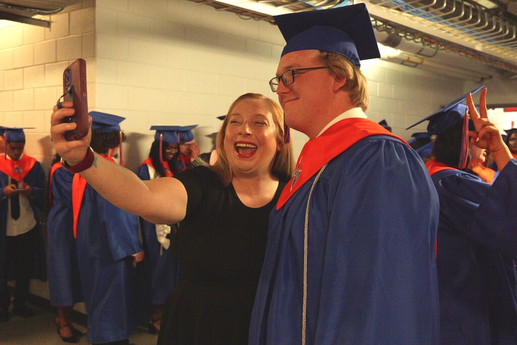 Midland Valley graduate taking a selfie with a teacher.