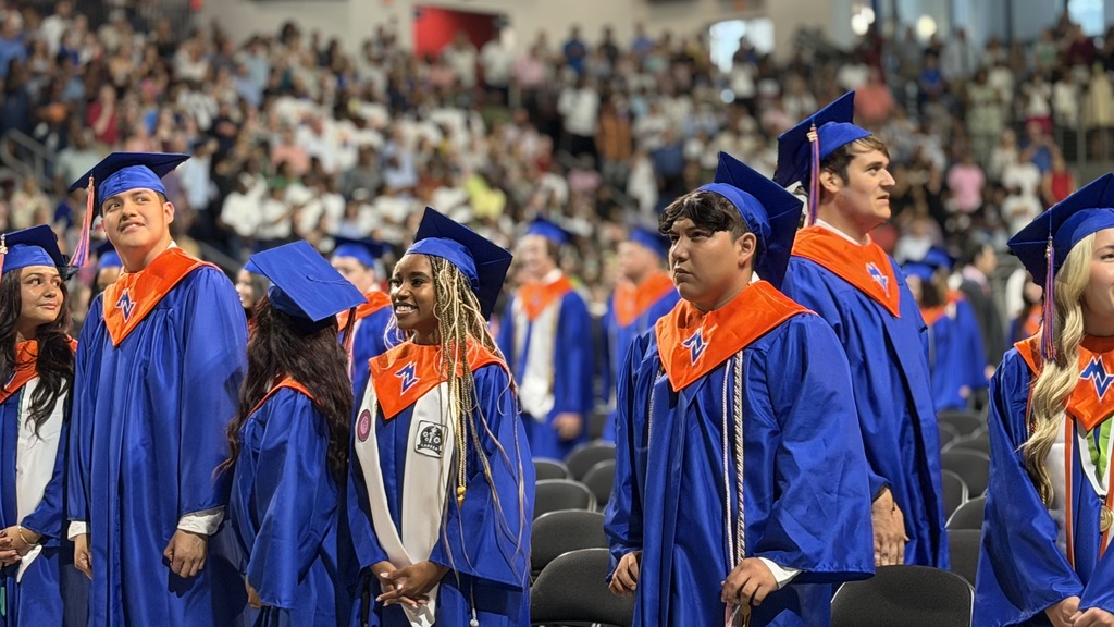 Graduates walking out for graduation.