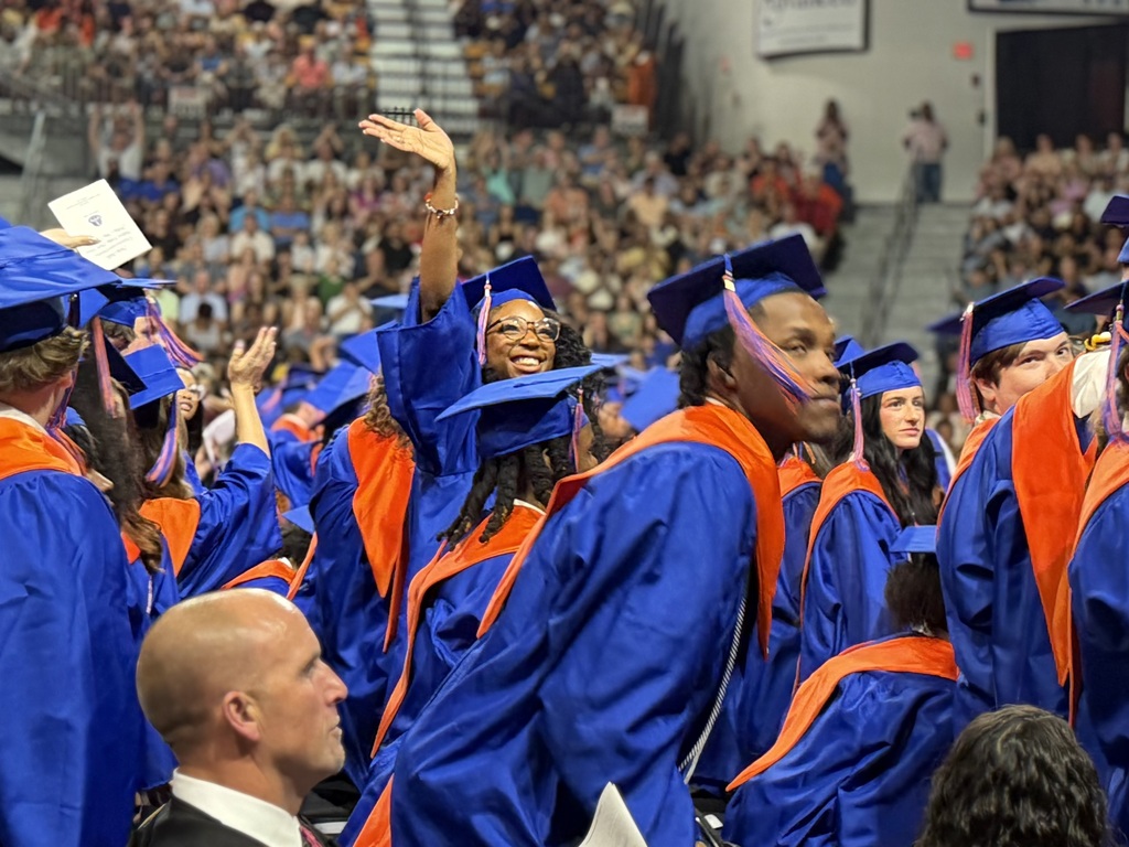 Graduates walking out for graduation.