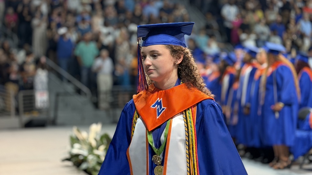 Graduates walking out for graduation.