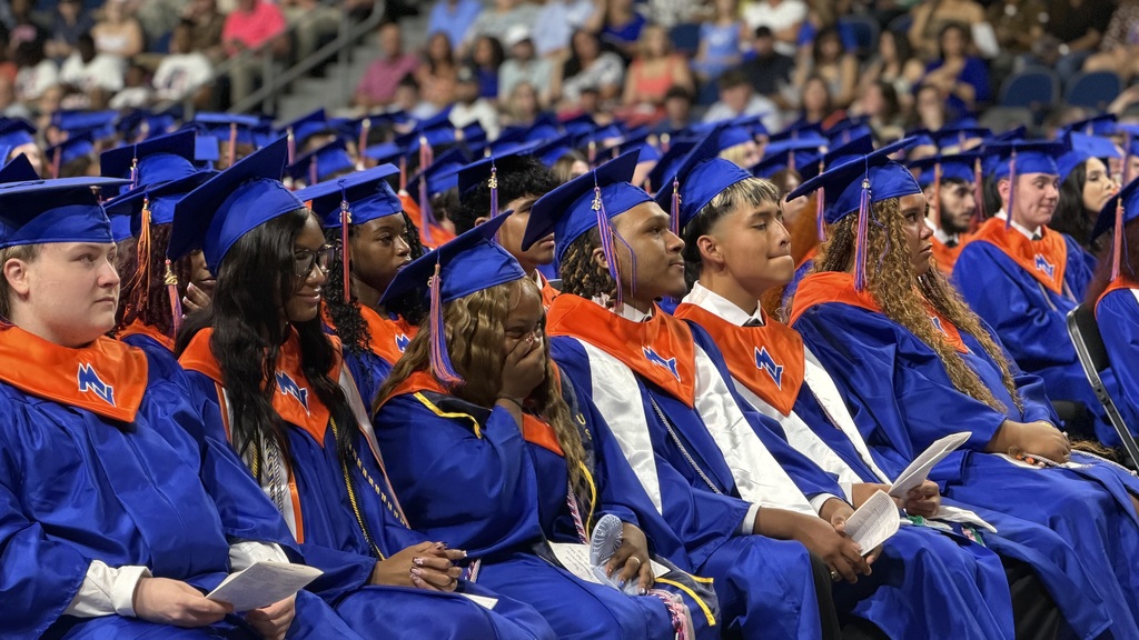 Graduates walking out for graduation.