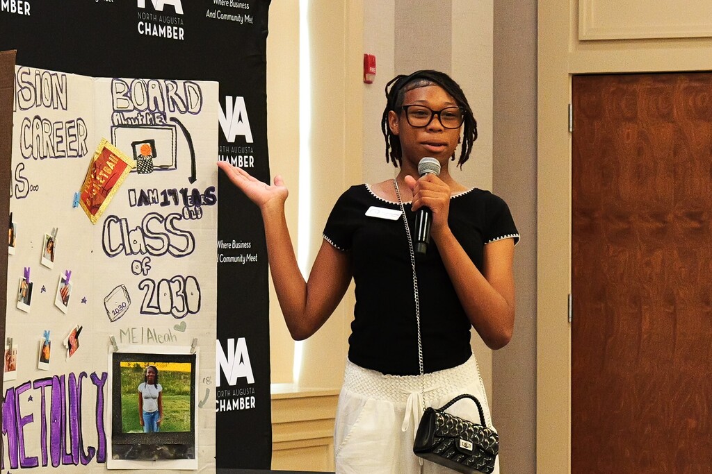 Junior Leadership graduate presenting her presentation at the graduation.