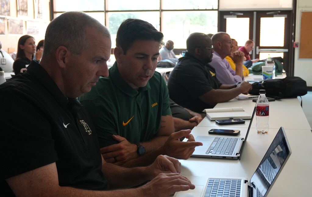 Two administrators collaborate together.