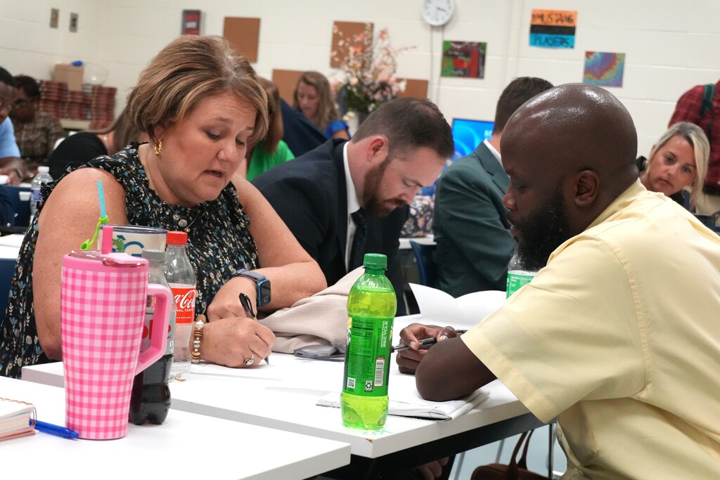 Administrators collaborate on a project during Ascend.