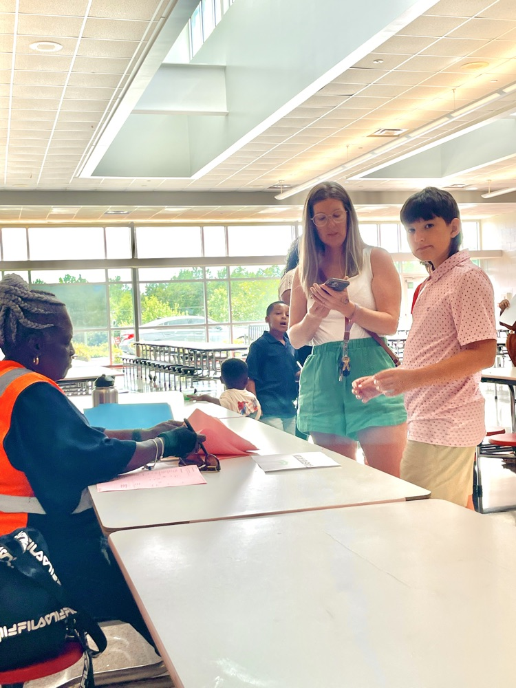 Transportation personnel speaking with a parent .