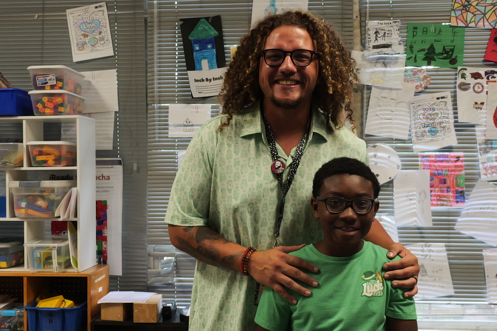 A student and teacher pose together at Belvedere Elementary.