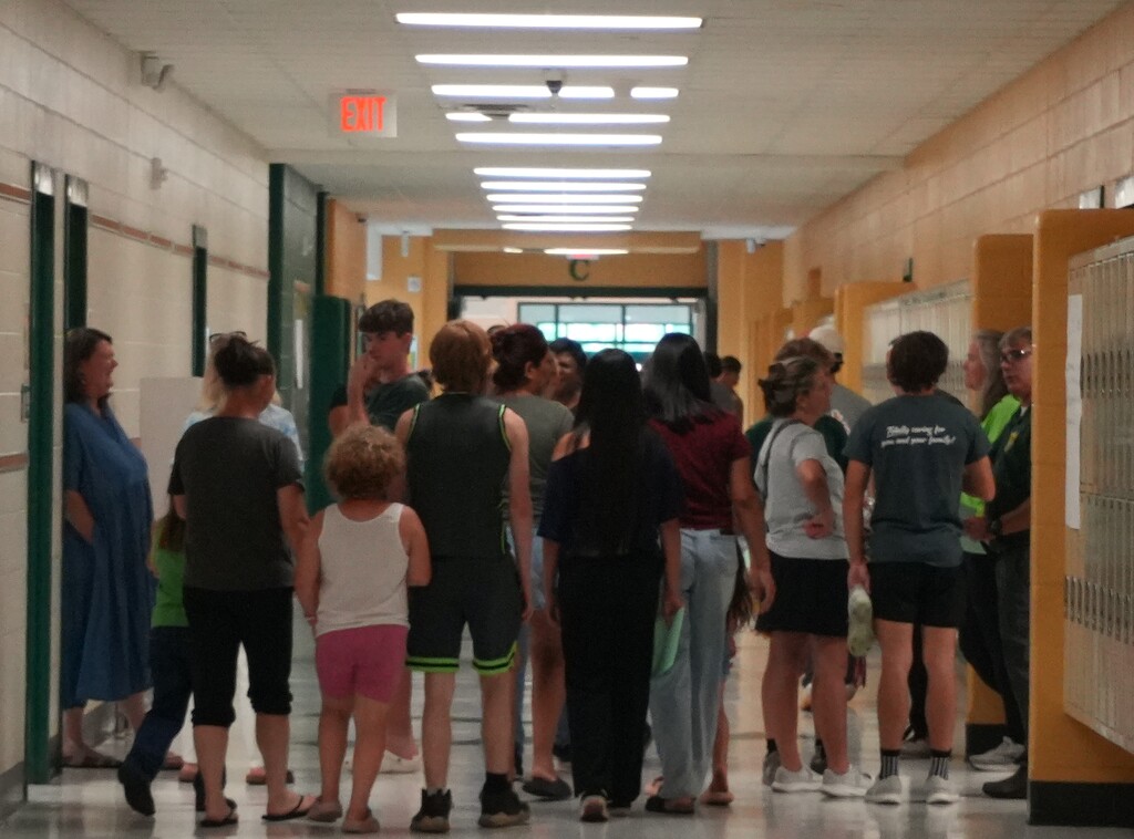Families gather in the hallways for Walk Your Schedule.