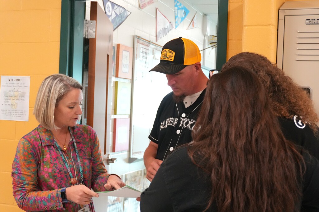 An Aiken High teacher helps a family navigate their schedule.