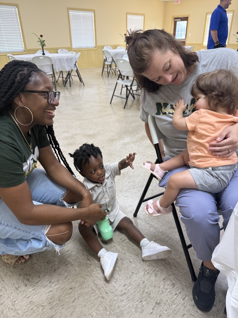 two people playing with babies 