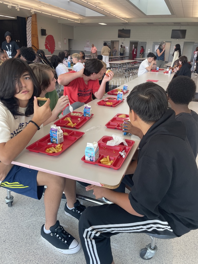 Students at lunch table.