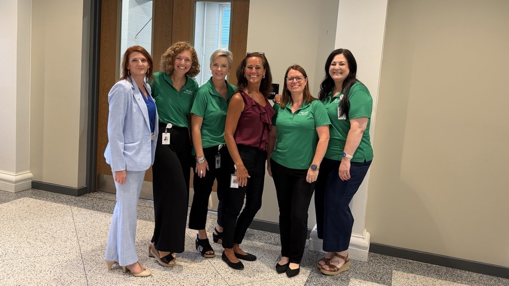 Dr. Coppock, Principal Carla Dupert and Human Resources staff pose for a photo.