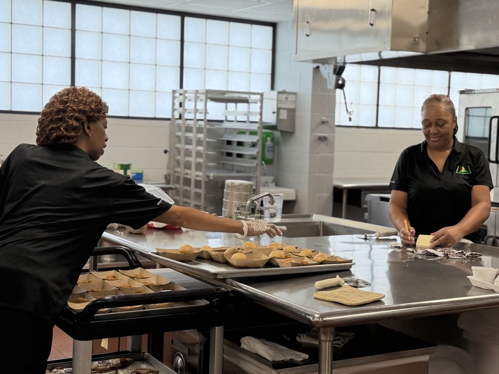 Child Nutrition cafeteria staff prepare lunch.
