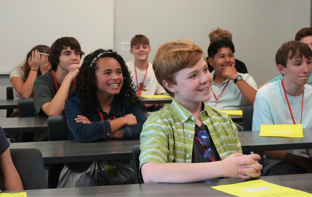 Aiken Scholars Academy students sit and listen to Superintendent Dr. Corey Murphy.