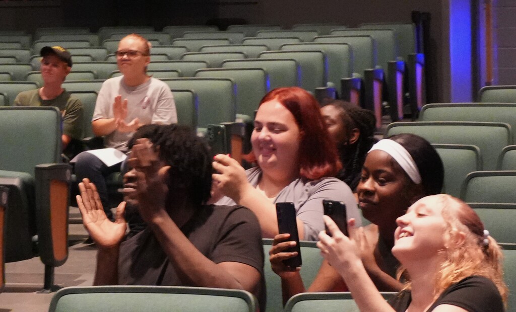 Family members celebrate their graduates.