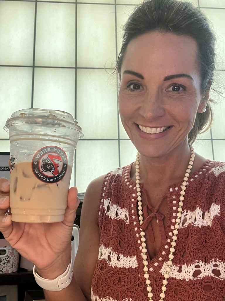 Teacher holding coffee