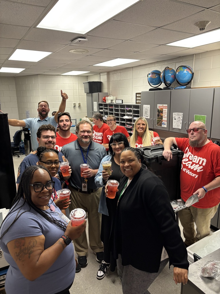 group of teachers with Victory Baptist members holding coffees