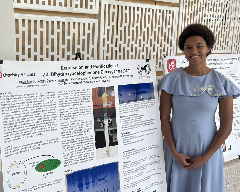 Student with presentation board.