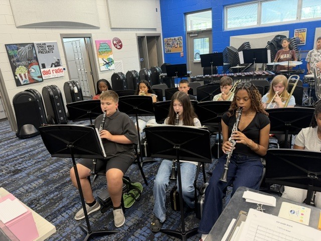 Students in band class rehearsing music