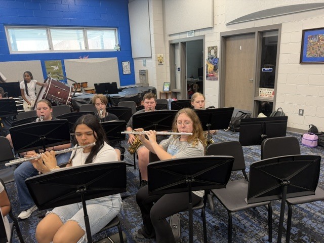 Students in band class rehearsing music