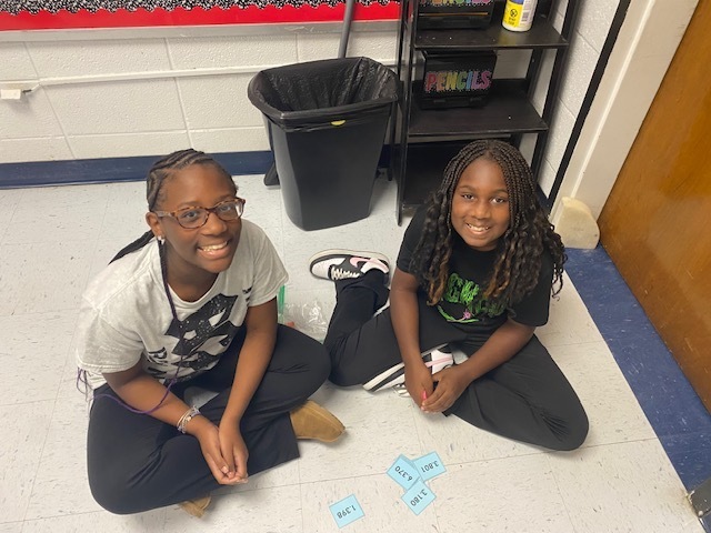 Fifth Graders working on Rounding