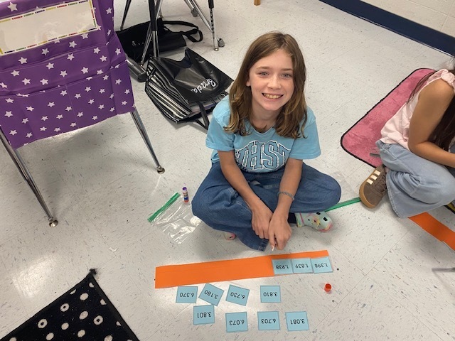 Fifth Graders working on Rounding