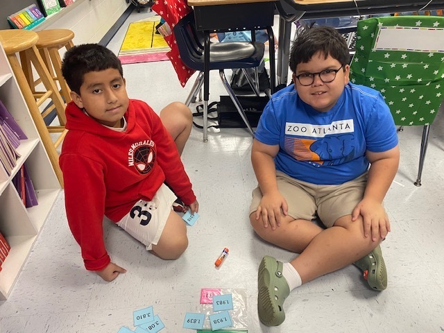Fifth Graders working on Rounding