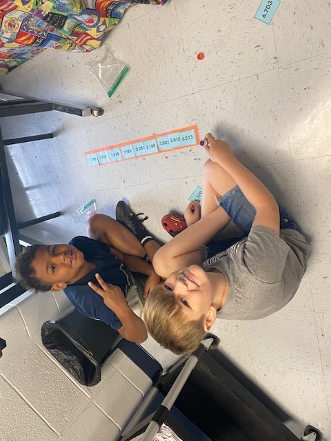 Fifth Graders working on Rounding