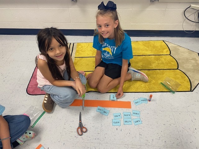 Fifth Graders working on Rounding