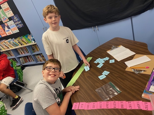 Fifth Graders working on Rounding