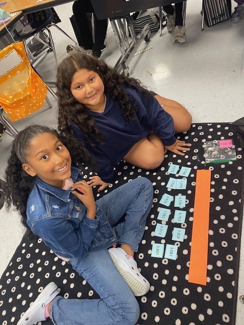 Fifth Graders working on Rounding