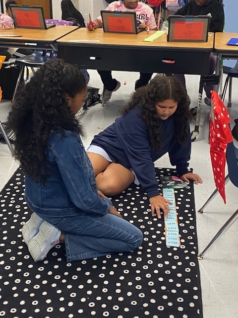 Fifth Graders working on Rounding