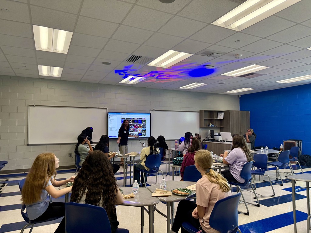 Mr. Berret presents to group of students in classroom