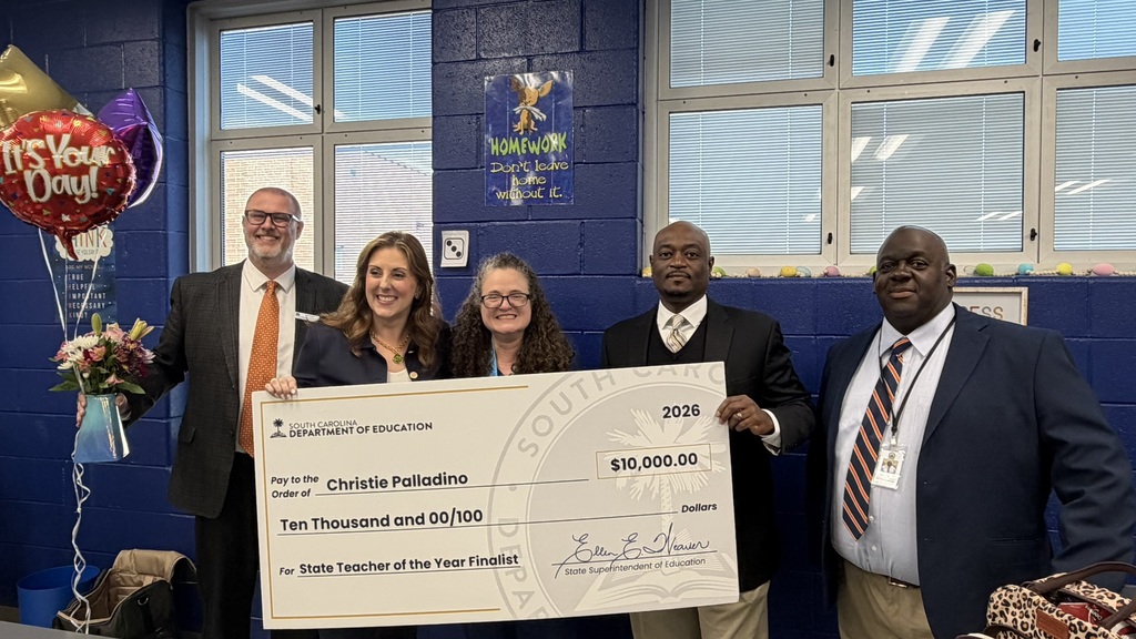 Dr. Palladino being presented her $10.000 check for being named a State Teacher of the Year Finalist.