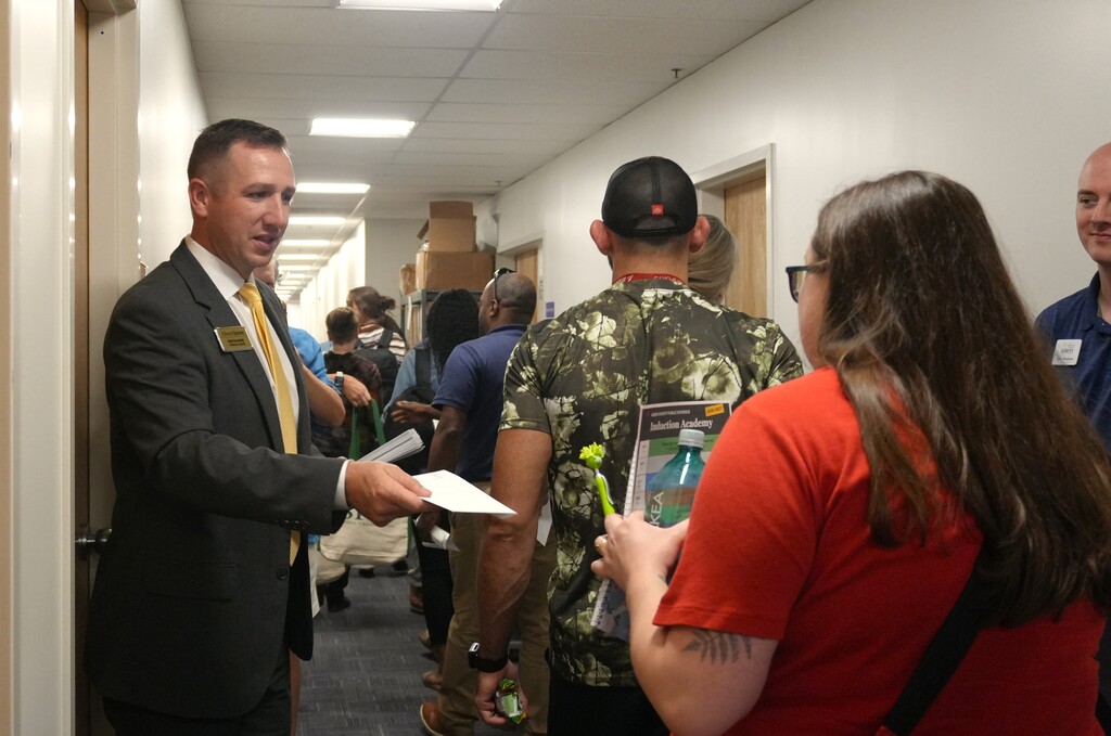 Cash is provided to first year teachers by community partners at Induction Academy.