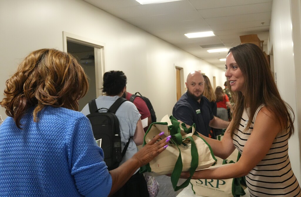 Community partners give out goodie bags to first year teachers.