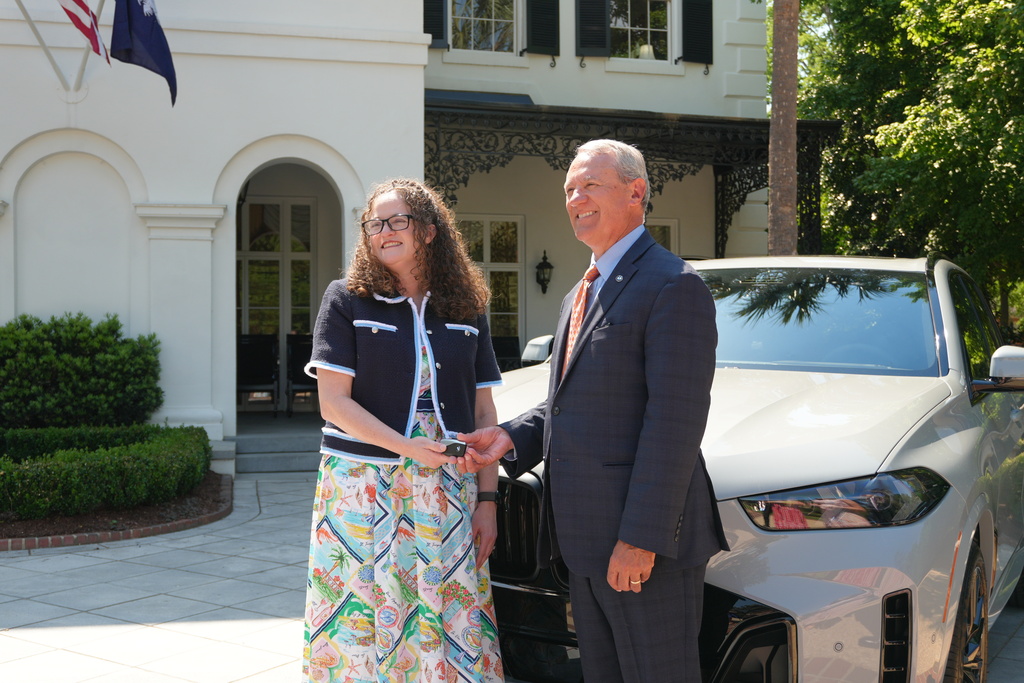 Dr. Palladino receiving her car prize at the Gala.
