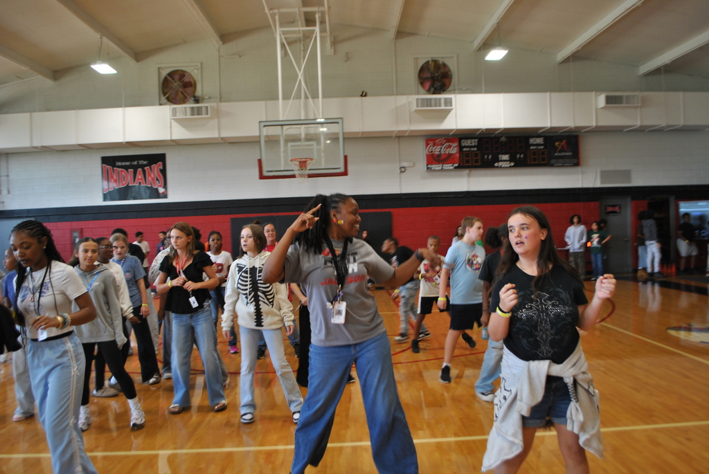 Ms. Qourters dancing with the scholars.
