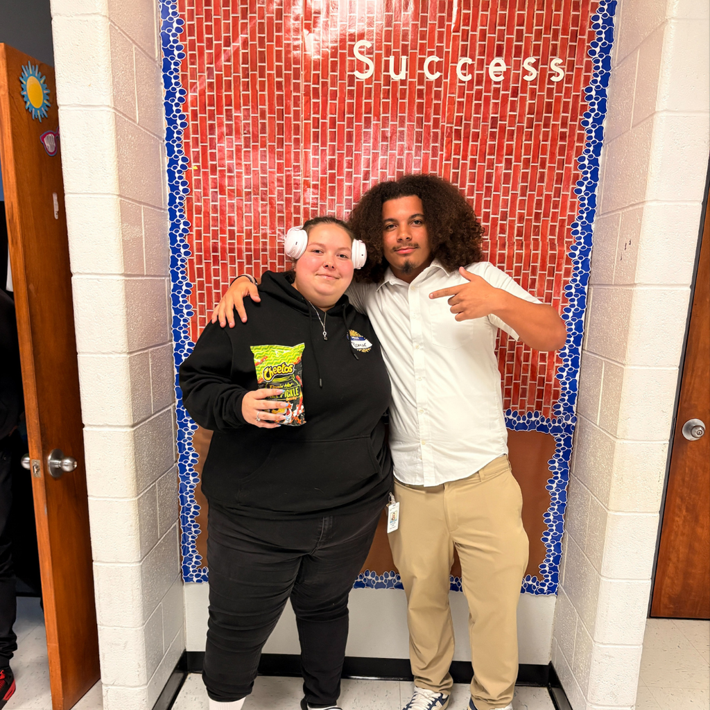 A teacher dressed as a student and a student dressed as a teacher